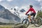 Senior Woman on electric bicycle in Engadin valley, Switzerland