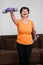 Senior woman exercising with barbells