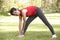 Senior Woman Exercising In Park