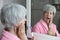 Senior woman experimenting pain while washing her teeth