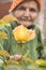 Senior woman with garden roses.