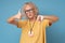 Senior woman with glasses showing thumbs up and thumbs down, difficult choose