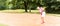 Senior woman at golf having stroke in sand bunker