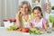 Senior woman with granddaughter cooking