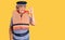 Senior woman with gray hair wearing nautical lifejacket doing ok sign with fingers, smiling friendly gesturing excellent symbol