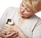 Senior woman with guinea pig - pet therapy