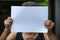 Senior woman Hands women holding paper blank a4 size in bokeh background, Selective focus, Communication, business concept