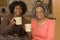 Senior woman having coffee with her daughter.