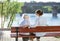 Senior woman and her adult granddaughter in summer park