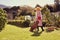 Senior woman in her backyard with faithful pet dog