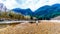 Senior woman on a hike along the Iron Oxide Stained rocks lining the shore of the Squamish River in British Columbia, Canada