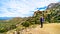 Senior woman hiker enjoying the view of the Valley of the Sun and the McDowell Mountain Range viewed from the Tom`s Thumb Trail