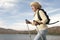 Senior Woman Hiking Beside Lake