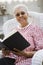 Senior Woman Holding Book