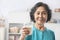 Senior woman holding glass of milk