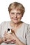 Senior woman holding guinea pig - pet therapy
