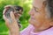 Senior woman holding little cat