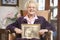 Senior woman holding an old wedding photo