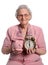 Senior Woman Holding Piggy Bank and Clock