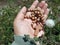 Senior woman holding wooden  rosary in hand with Jesus Christ Cross Crucifix. Christian Catholic religious symbol of faith concept