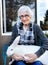 Senior Woman Holds Her Pet Flemish Giant Rabbit