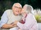 Senior Woman Kissing On Man\'s Cheek