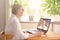 Senior woman laptop online therapy