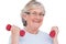 Senior woman lifting hand weights