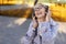 Senior woman listening to music in nature, woman listening music with wireless headphones cheerful in park