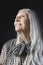 Senior Woman With Long Gray Hair Looking Up