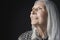 Senior Woman With Long Gray Hair Looking Up