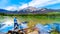 Senior woman looking at Pyramid Mountain in Pyramid Lake in Jasper National Park