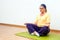 Senior woman meditating in gym.