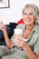 Senior woman with milky macchiato coffee