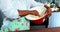 Senior woman mixing flour in a bowl