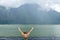 Senior woman in the nature swimming pool with amazing mountain background. Tropical island Bali, Indonesia.