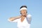 Senior woman neck pain sky background