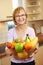 Senior woman offering fruits