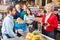 Senior woman paying at checkout in the supermarket