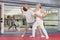 Senior woman performing chin strike during self-defence training