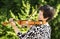 Senior woman performing music outdoors