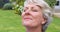 Senior woman performing yoga in garden