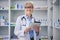 Senior woman, pharmacist and clinic tablet portrait with medical stock and digital research. Pharmacy, healthcare store