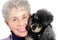 Senior woman portrait with her poodle