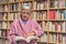 Senior woman reading a book at home. concentrated expression. A