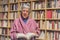 Senior woman reading a book at home. Happy expression. A blurred