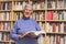 Senior woman reading a book at home. Happy expression. A blurred