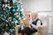 Senior woman reading a book to her great grandson