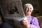 Senior woman reading morning newspaper