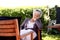 Senior woman relaxing in backyard garden